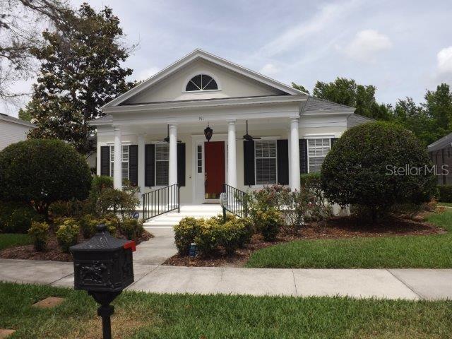 911 Spring Park Loop, Unit 911 Celebration, FL 34747 - Photo 1 of 1 a front view of a house with a yard