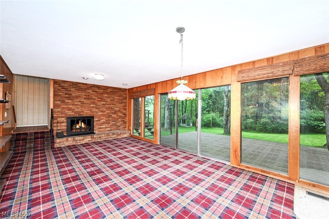 2987 Sourek Road Akron, OH 44333 - Photo 22 of 44 *OK, SO THIS IS THE BEST VIEW EVER! GORGEOUS FLOOR TO CEILING WINDOWS IN THE FAMILY RM WITH BRICK FIREPLACE ~