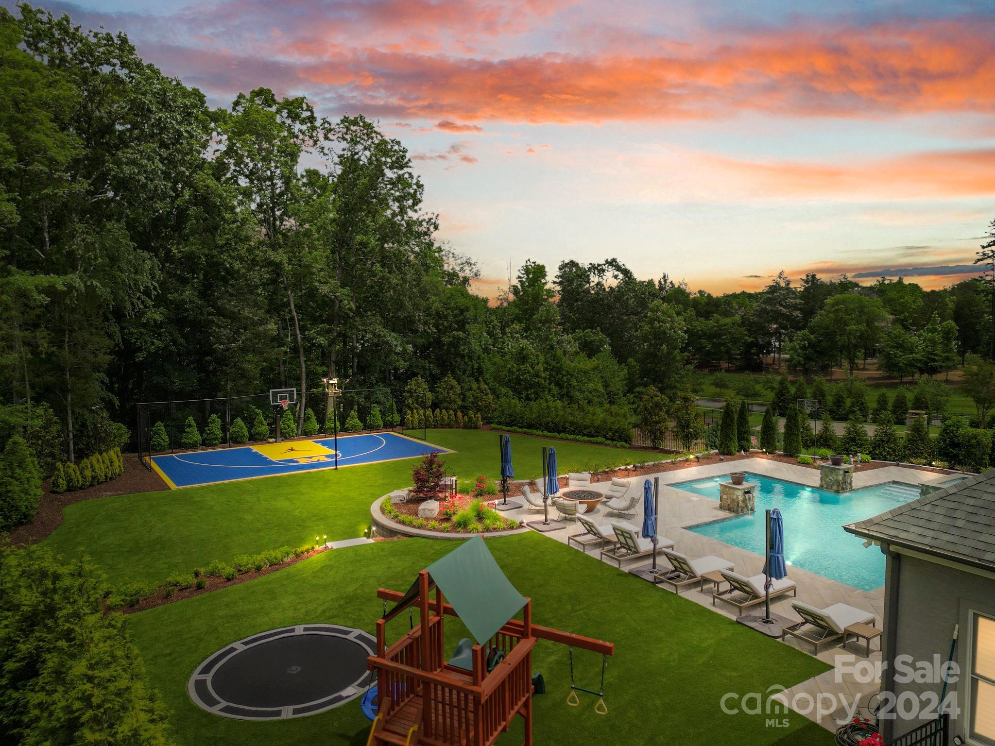 a view of a swimming pool with a table and chairs