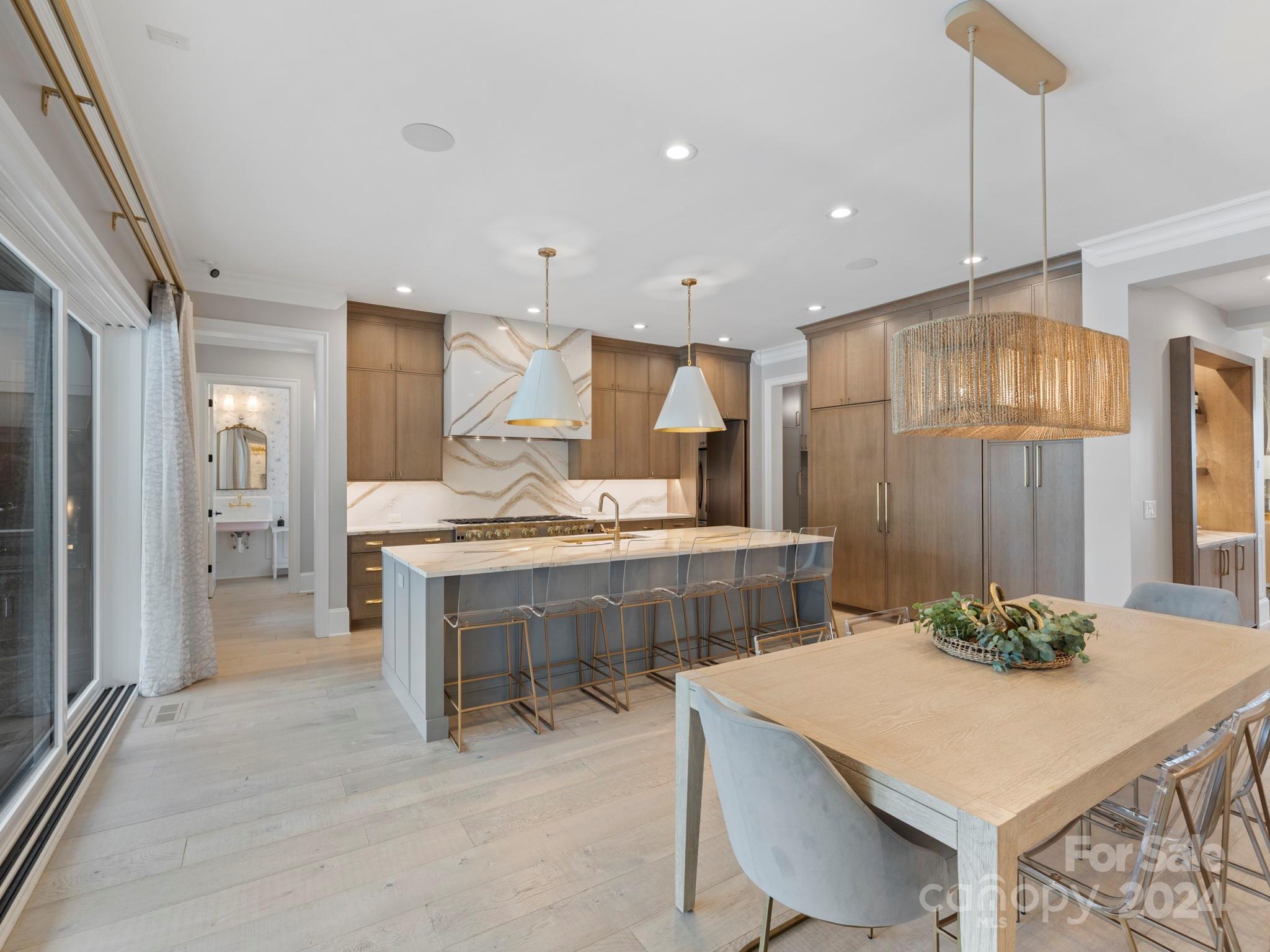 16520 Reinsch Drive Davidson, NC 28036 - Photo 12 of 37 a kitchen with a table chairs sink and refrigerator