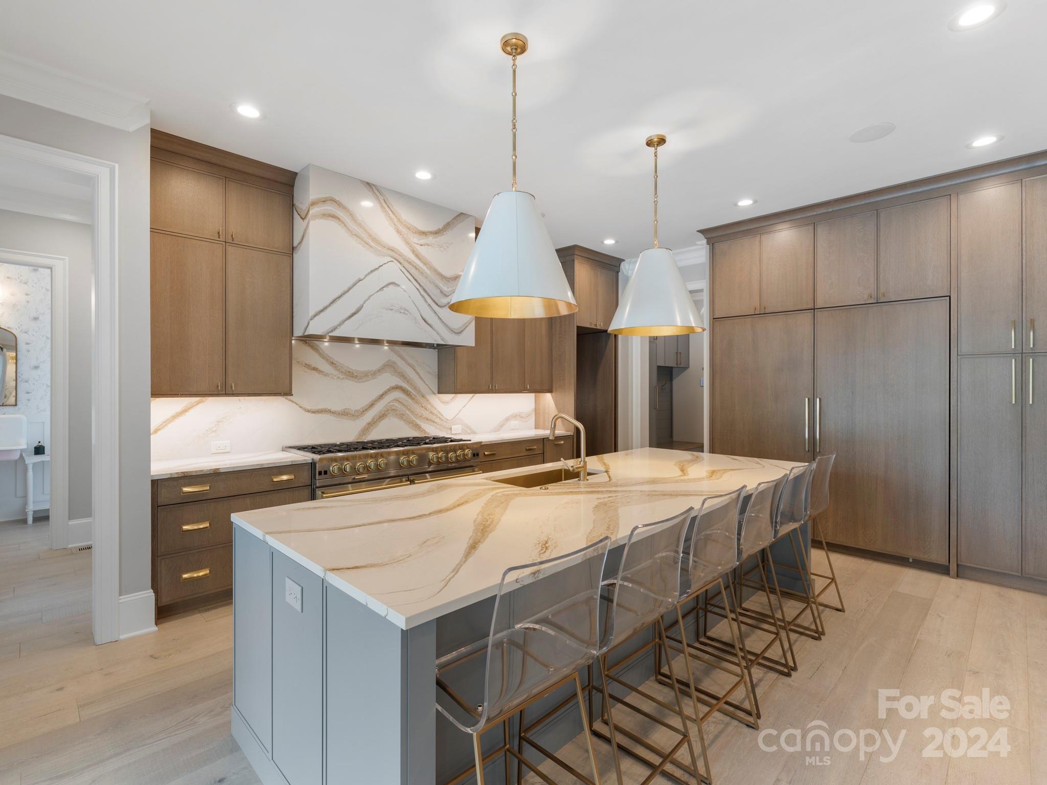 16520 Reinsch Drive Davidson, NC 28036 - Photo 14 of 37 a kitchen that has a stove a table and chairs in it