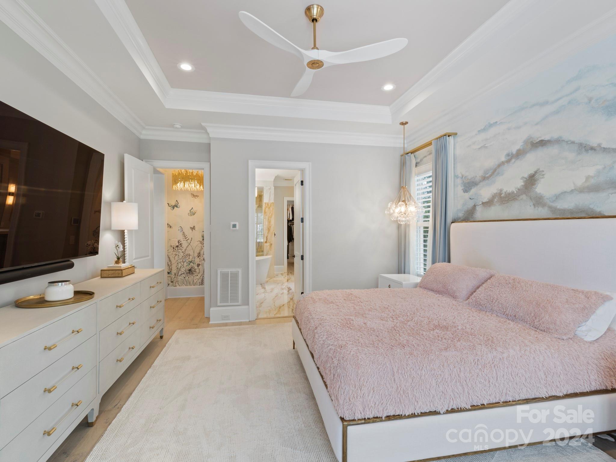 16520 Reinsch Drive Davidson, NC 28036 - Photo 19 of 37 a spacious bedroom with a large bed and a flat screen tv