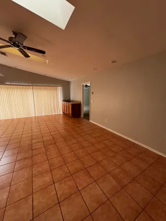 a view of an empty room and a window