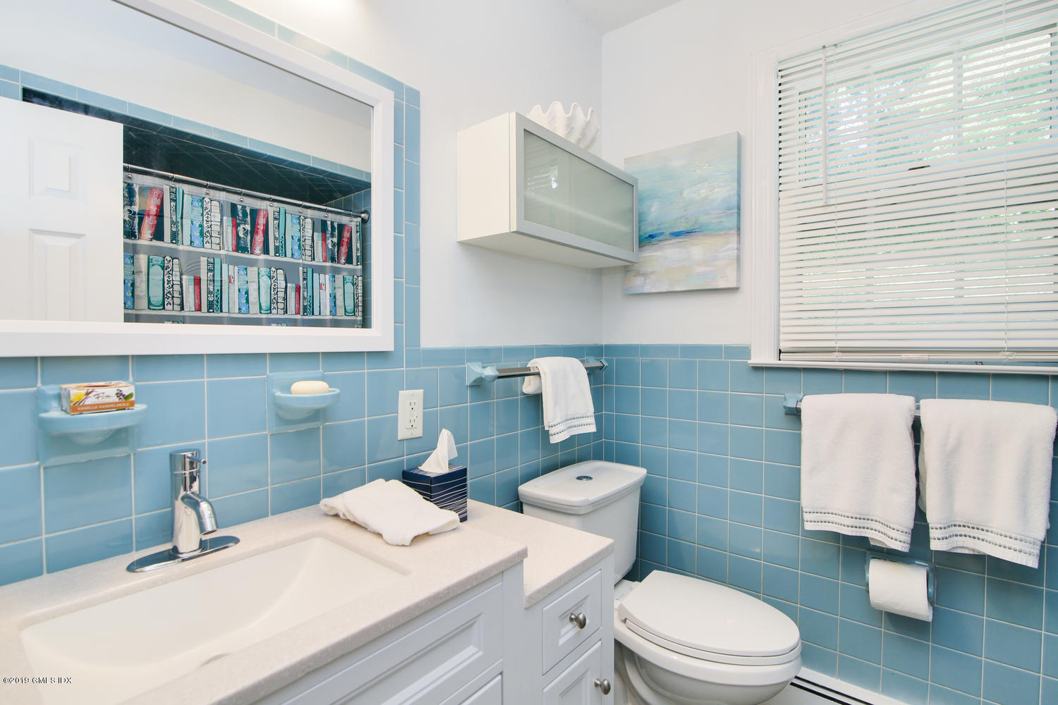 8 Marks Road Riverside, CT 06878 - Photo 21 of 24 a bathroom with a sink a toilet and a mirror