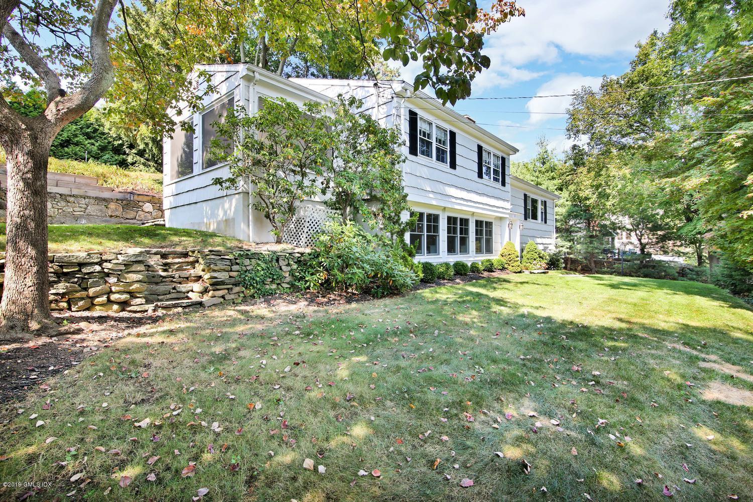 8 Marks Road Riverside, CT 06878 - Photo 4 of 24 a front view of a house with a yard