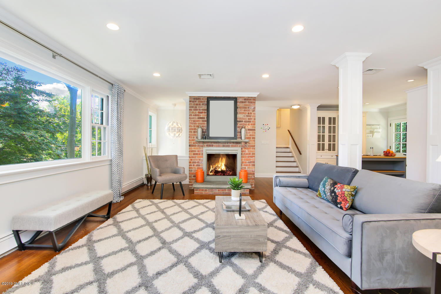 8 Marks Road Riverside, CT 06878 - Photo 5 of 24 a living room with furniture a large window and a fireplace