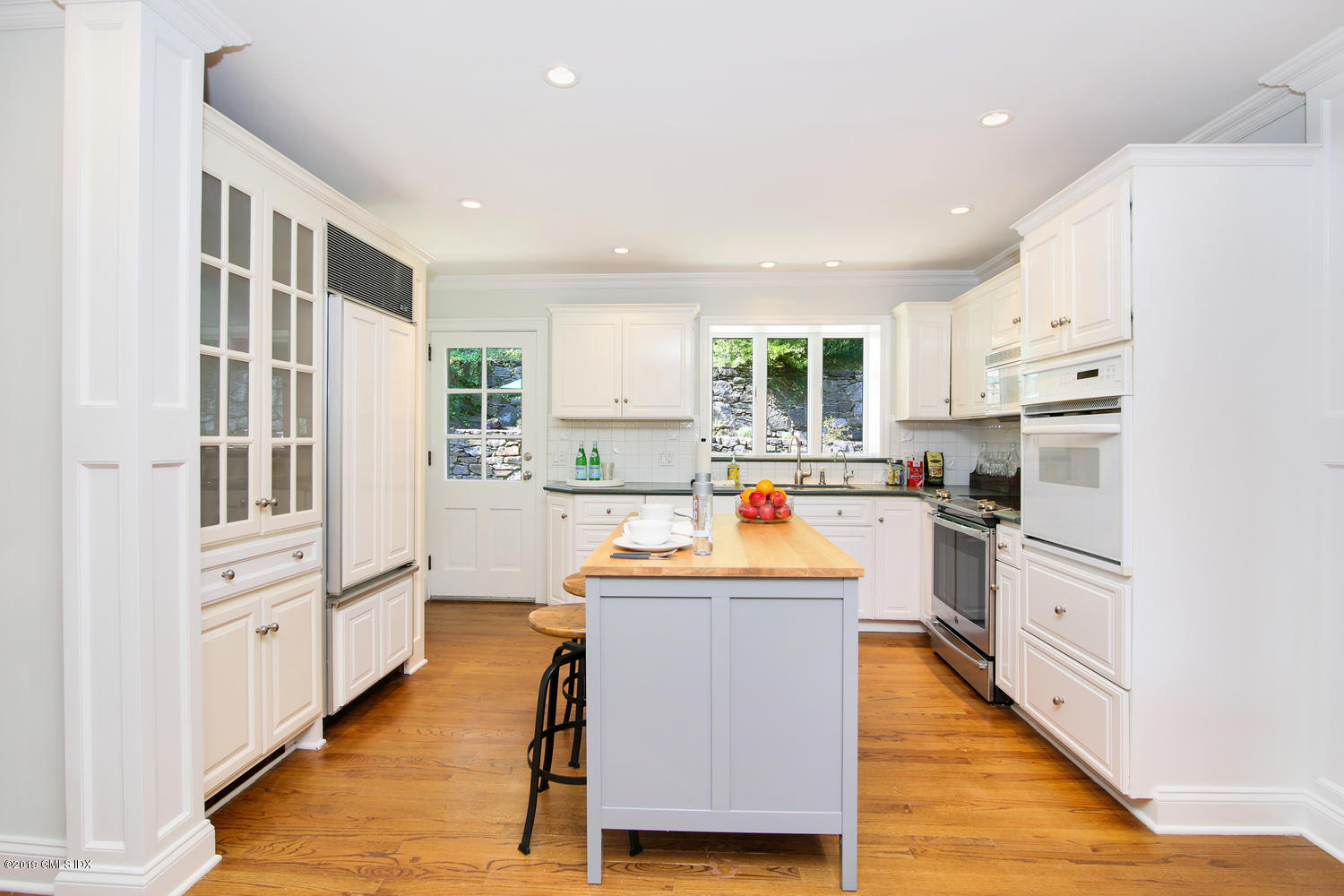8 Marks Road Riverside, CT 06878 - Photo 10 of 24 a kitchen with white cabinets and stainless steel appliances