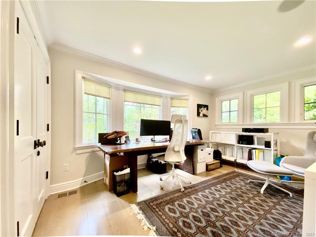 7 Whaling Road Darien, CT 06820 - Photo 12 of 34 a living room with furniture a piano and a flat screen tv