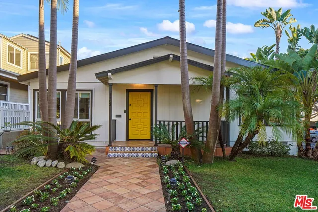 a living room with fireplace furniture and a large window