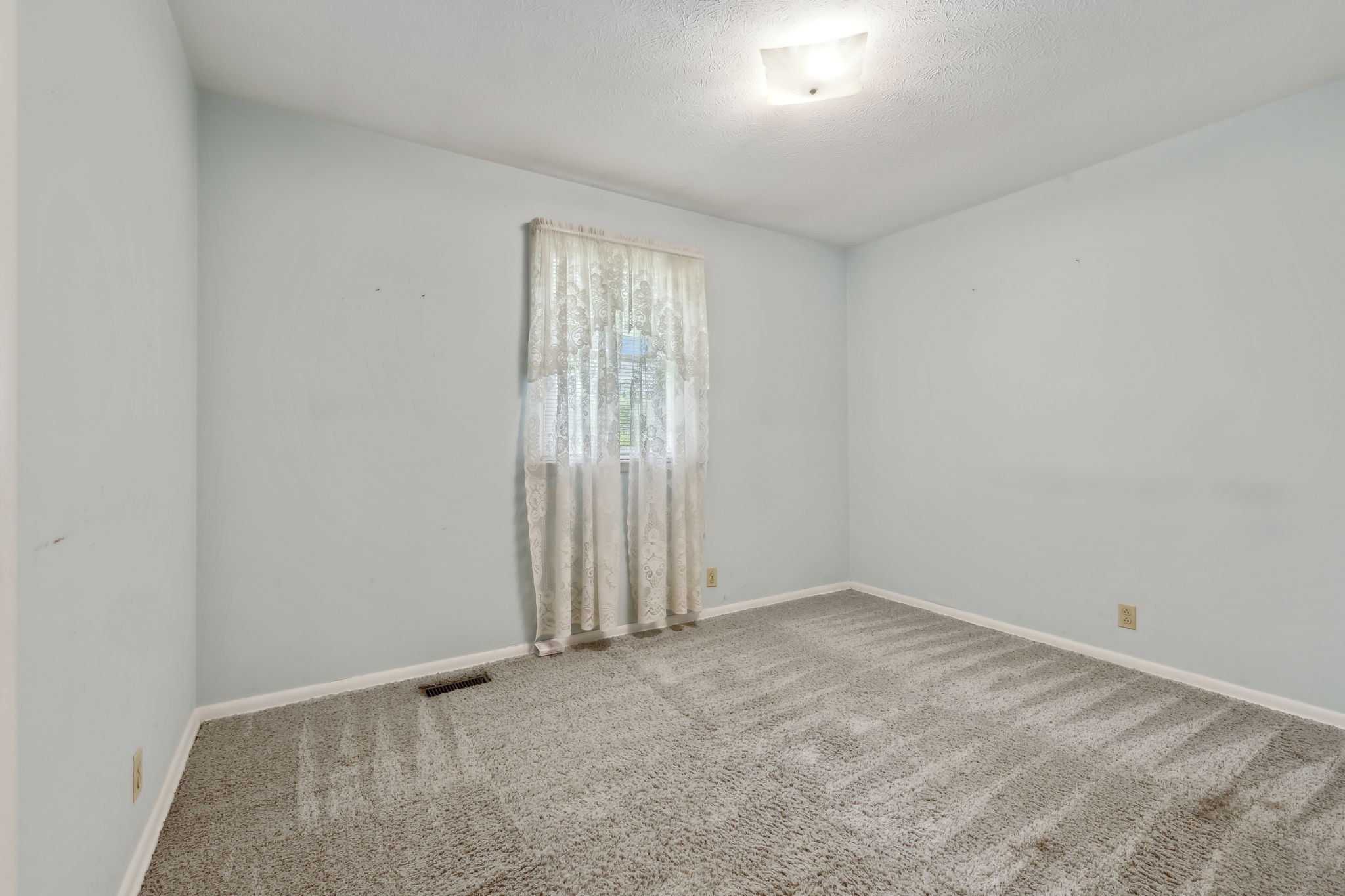10924 Rials Branch Road Bon Aqua, TN 37025 - Photo 17 of 34 an empty room with windows