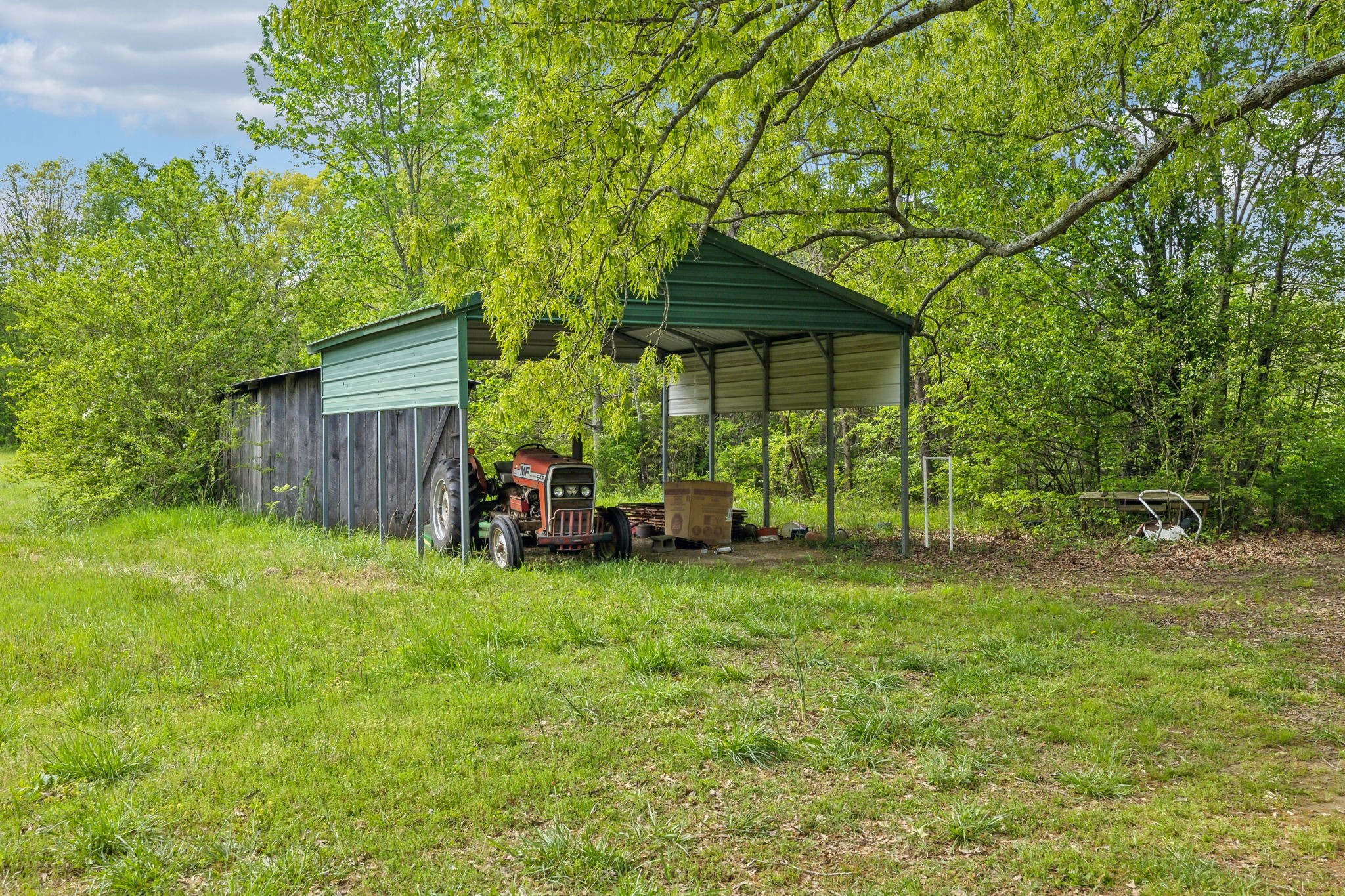 10924 Rials Branch Road Bon Aqua, TN 37025 - Photo 21 of 34 a view of a house with backyard and sitting area