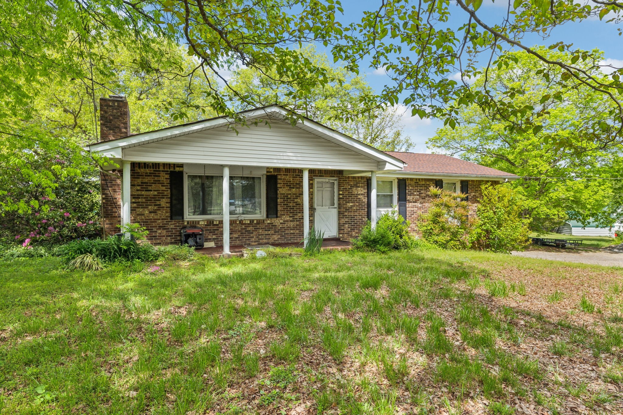 10924 Rials Branch Road Bon Aqua, TN 37025 - Photo 4 of 34 a backyard of a house with seating space