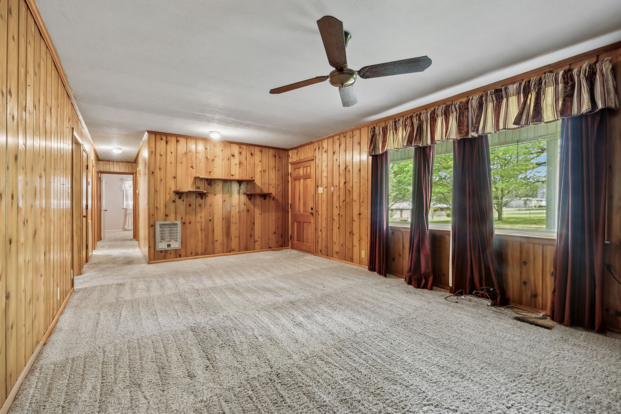 10924 Rials Branch Road Bon Aqua, TN 37025 - Photo 9 of 34 a view of a hallway with wooden floor and staircase