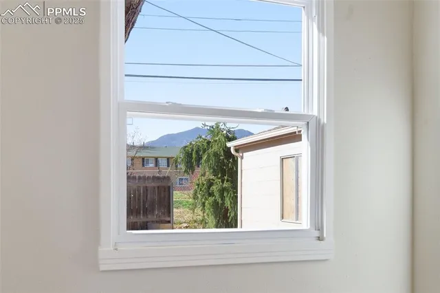 a bathroom with a toilet a sink and a window