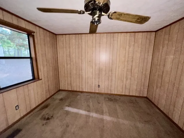 a view of a room with a window and a shower