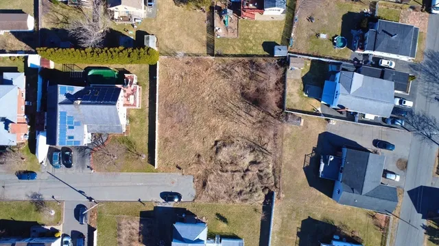 an aerial view of houses and roads