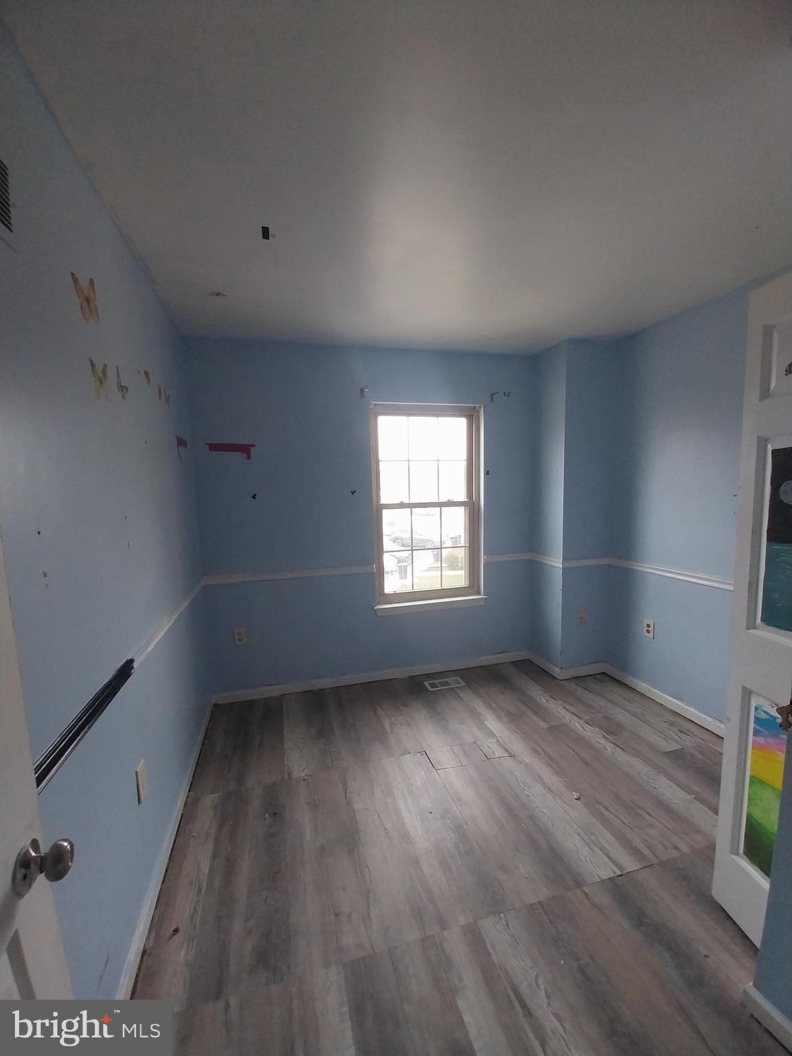 416 Pinetree Court Pottstown, PA 19464 - Photo 11 of 15 an empty room with wooden floor and windows