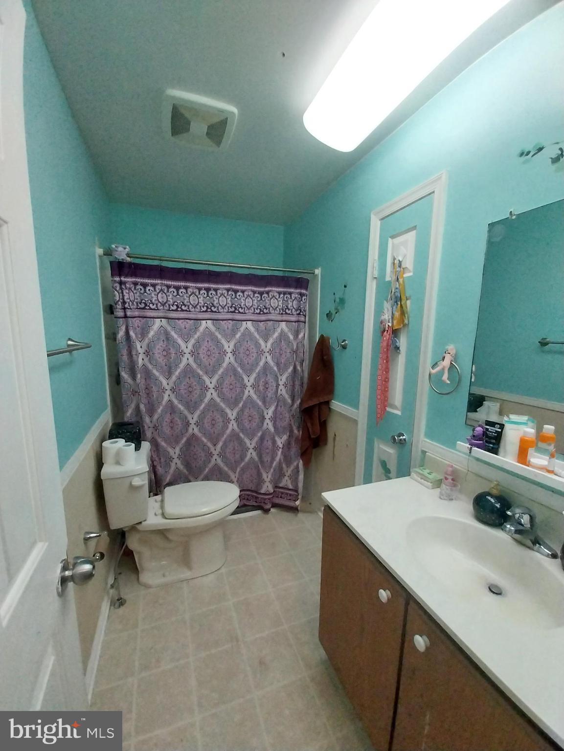 416 Pinetree Court Pottstown, PA 19464 - Photo 14 of 15 a bathroom with a sink and a mirror
