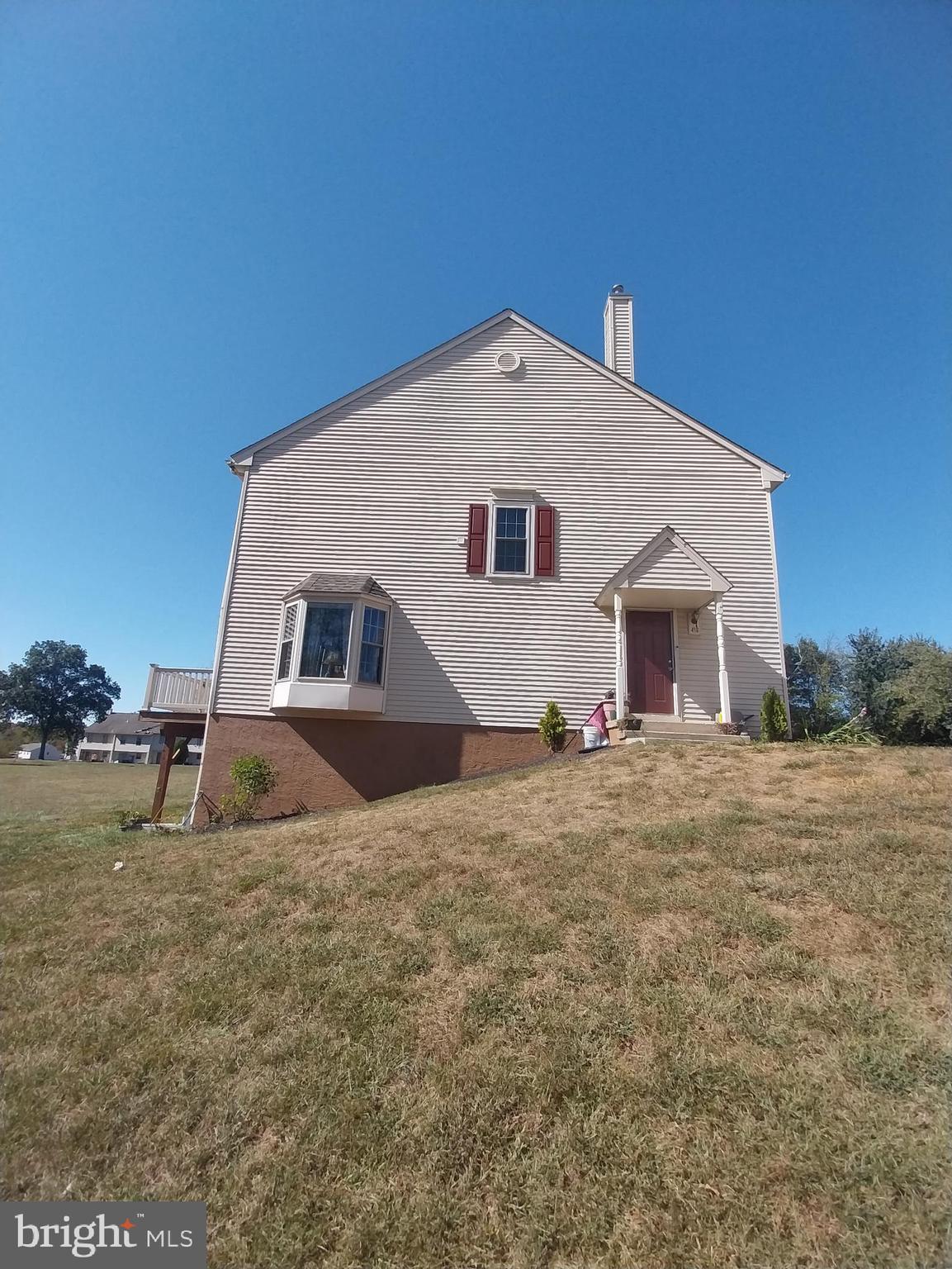416 Pinetree Court Pottstown, PA 19464 - Photo 2 of 15 a front view of a house with a yard