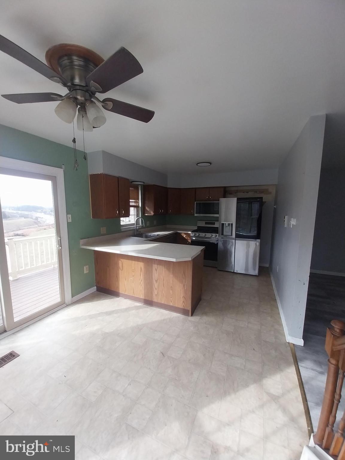 416 Pinetree Court Pottstown, PA 19464 - Photo 8 of 15 a large kitchen with stainless steel appliances a stove a refrigerator and a sink