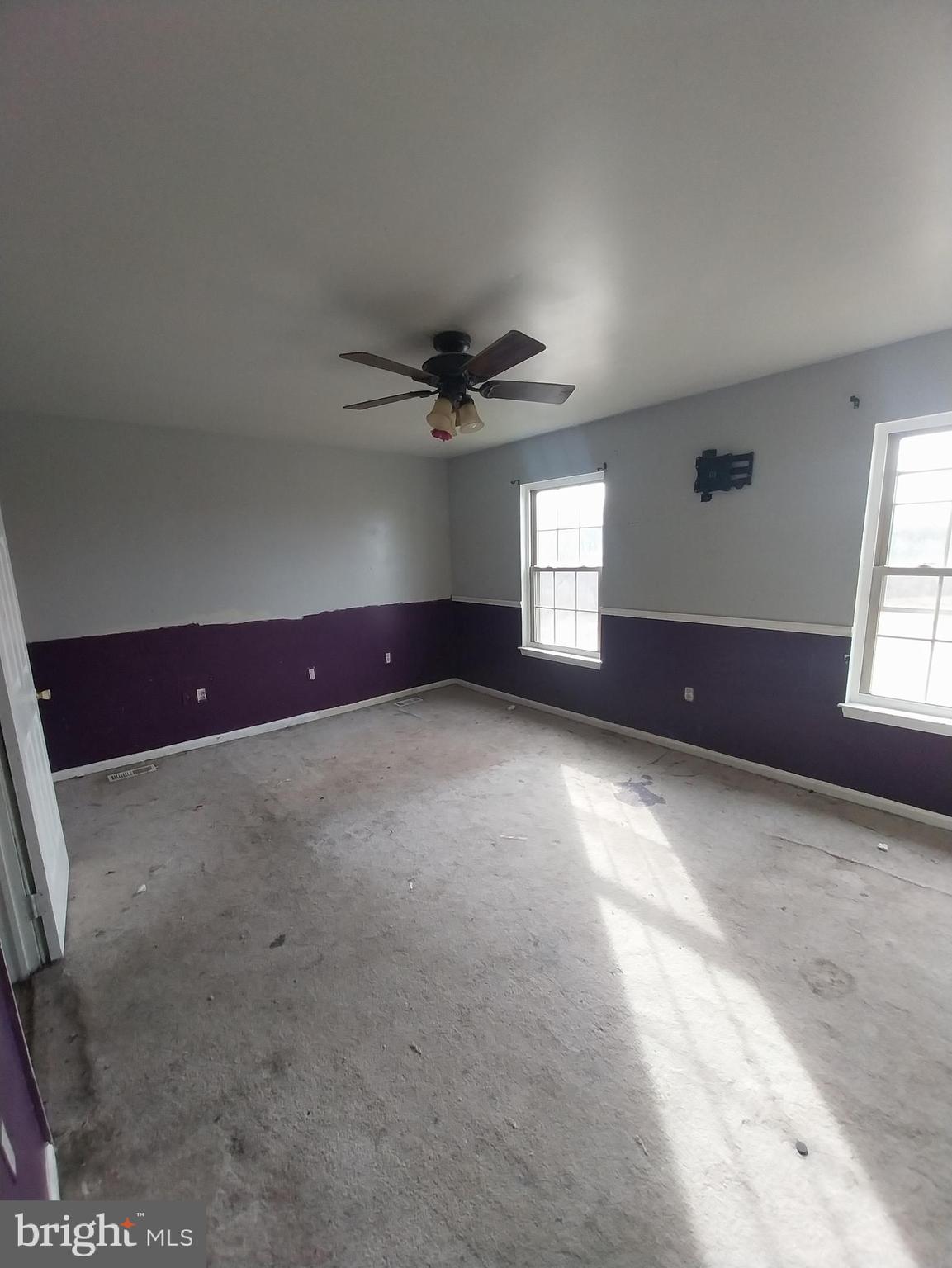 416 Pinetree Court Pottstown, PA 19464 - Photo 9 of 15 an empty room with windows and fan