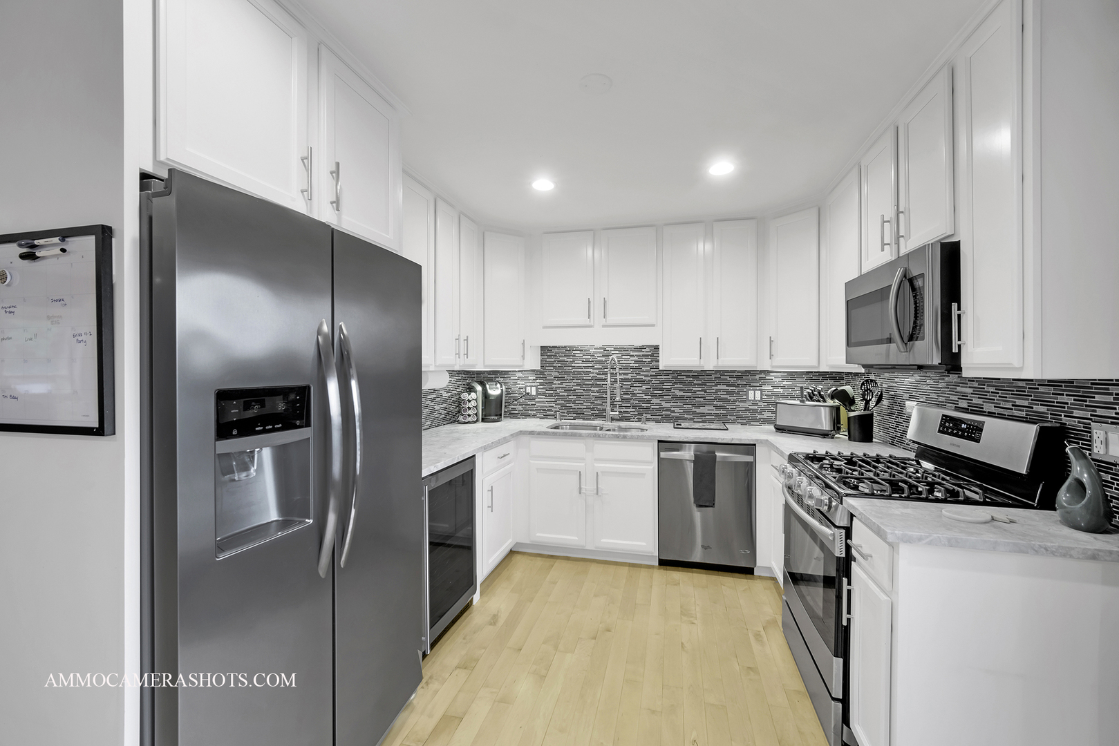 695 Rodenburg Road Roselle, IL 60172 - Photo 7 of 27 a kitchen with stainless steel appliances granite countertop a stove a refrigerator and a sink
