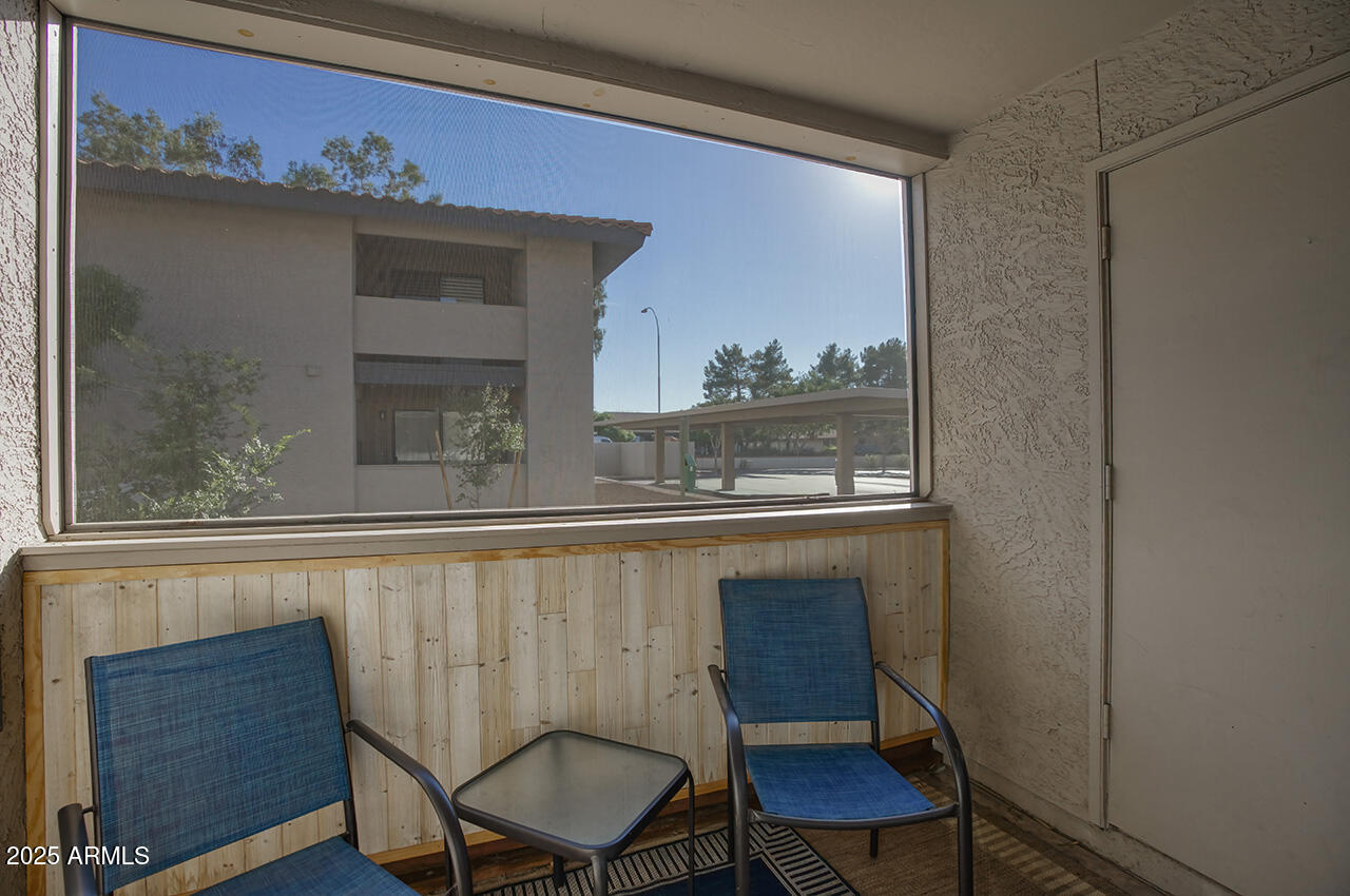 1402 East Guadalupe Road, Unit 149 Tempe, AZ 85283 - Photo 12 of 16 a bathroom with a sink a chair and a window