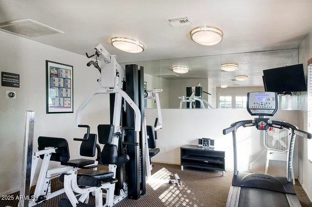 a view of a livingroom with furniture and a flat screen tv