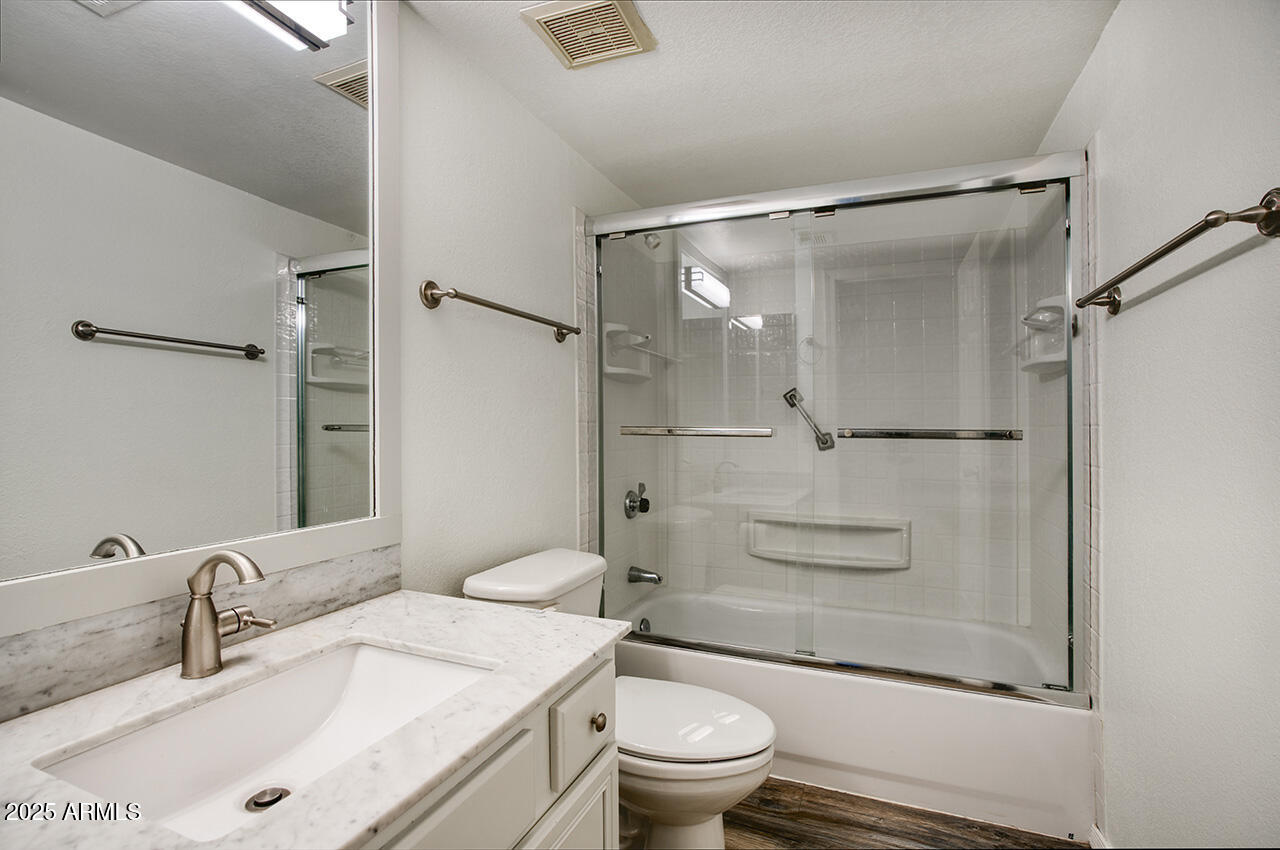 1402 East Guadalupe Road, Unit 149 Tempe, AZ 85283 - Photo 4 of 16 a bathroom with a sink toilet and shower