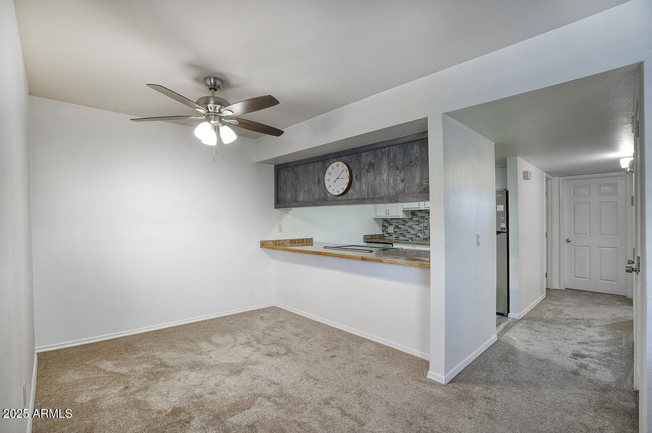1402 East Guadalupe Road, Unit 149 Tempe, AZ 85283 - Photo 9 of 16 a view of kitchen with stainless steel appliances granite countertop cabinets and fireplace