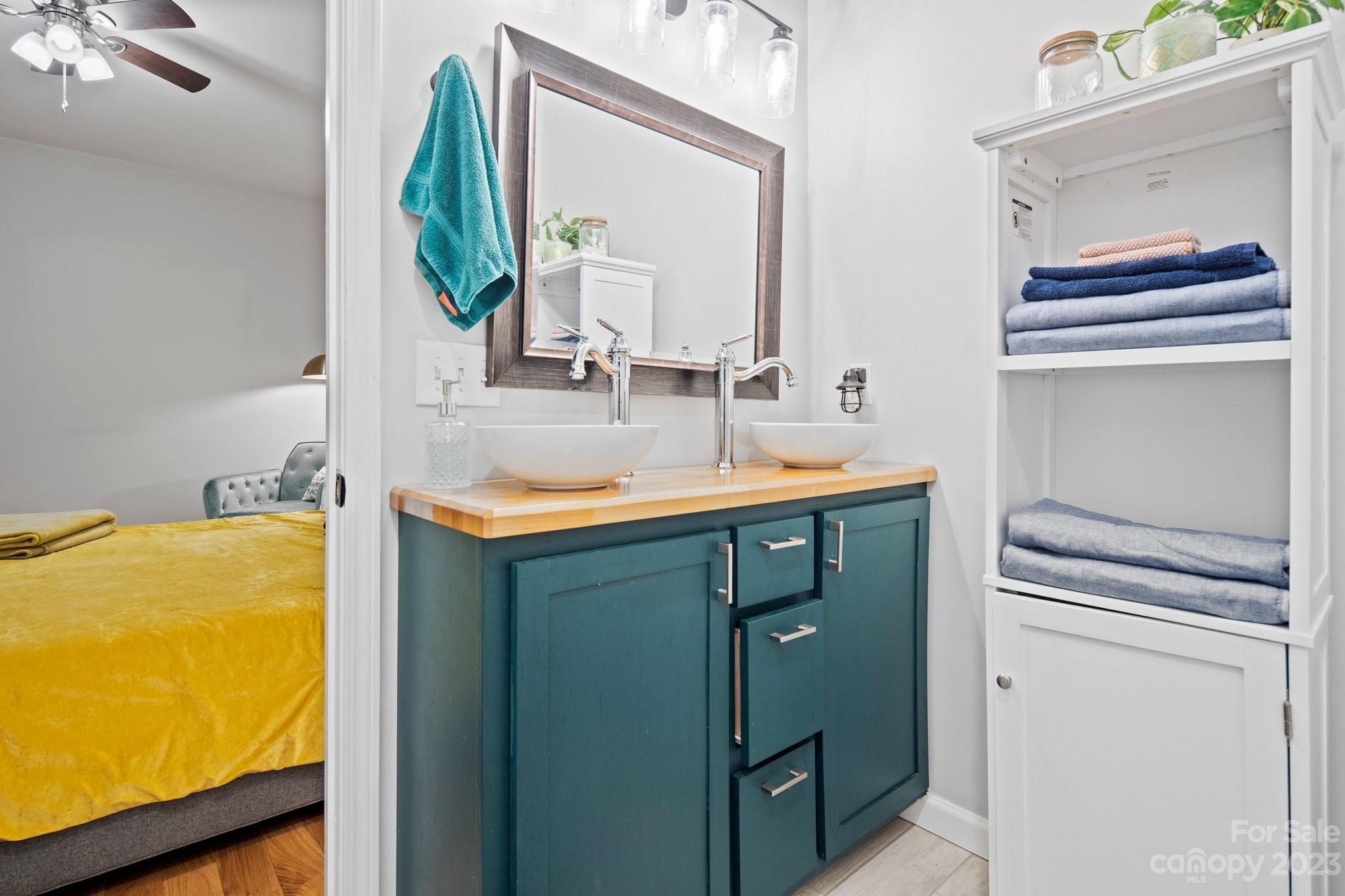 32 Stuart Street Canton, NC 28716 - Photo 18 of 27 a bathroom with a sink and a mirror