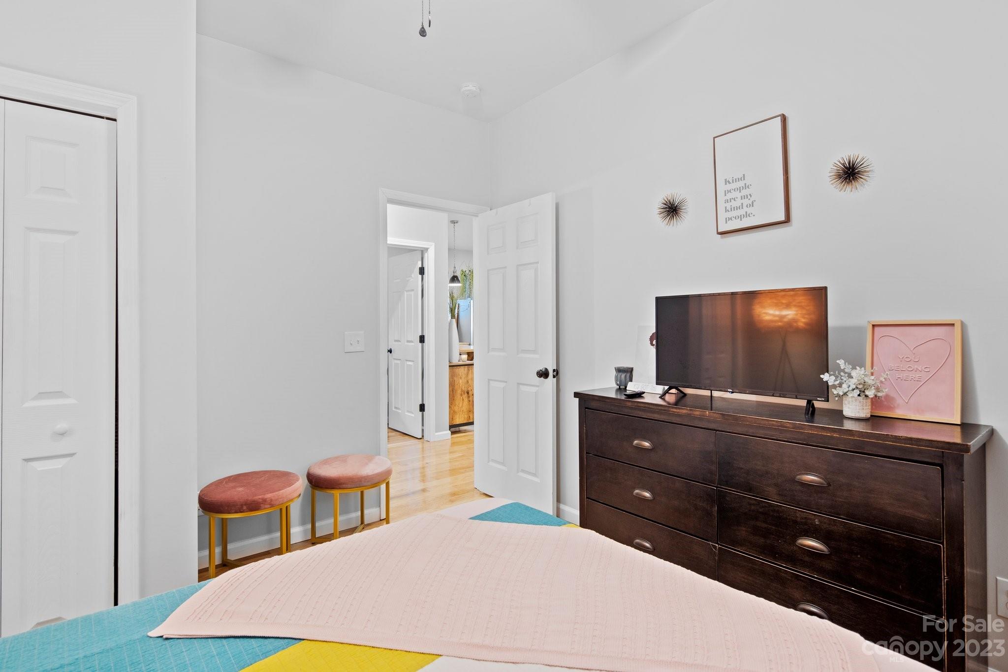 32 Stuart Street Canton, NC 28716 - Photo 21 of 27 a bedroom with a bed and a flat screen tv