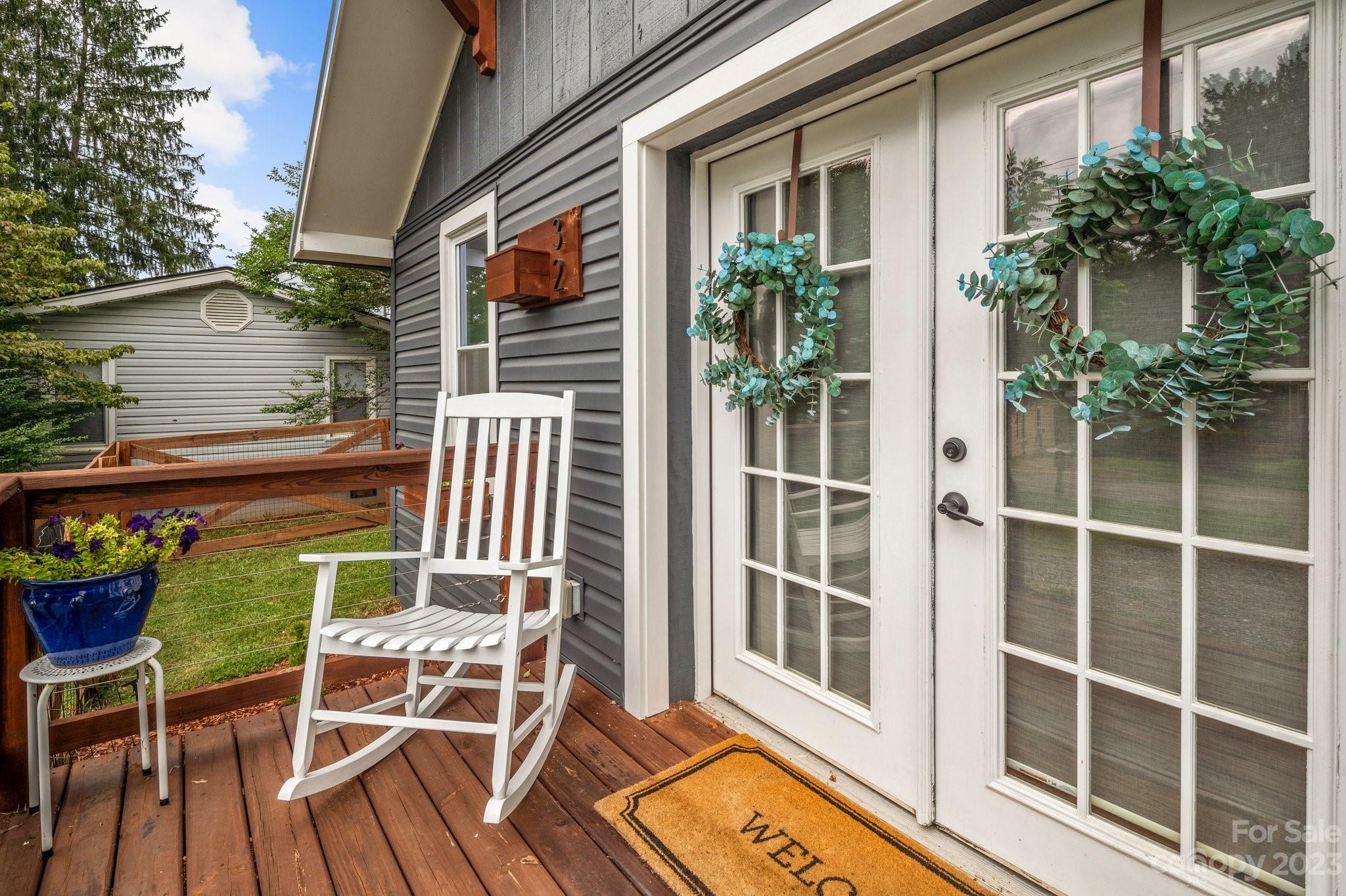 32 Stuart Street Canton, NC 28716 - Photo 3 of 27 a view of a chair and table in the balcony