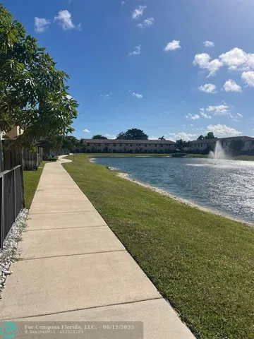 a front view of a house with yard