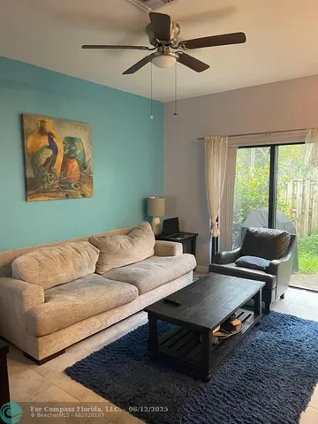 a kitchen with kitchen island granite countertop a sink stove and cabinets