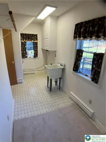 a bathroom with a sink and a window