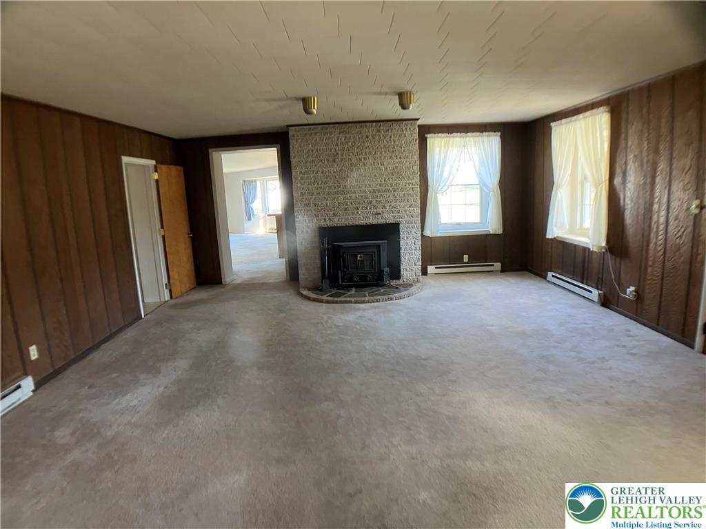 4131 Orefield Road Allentown, PA 18104 - Photo 16 of 20 an empty room with windows and fireplace