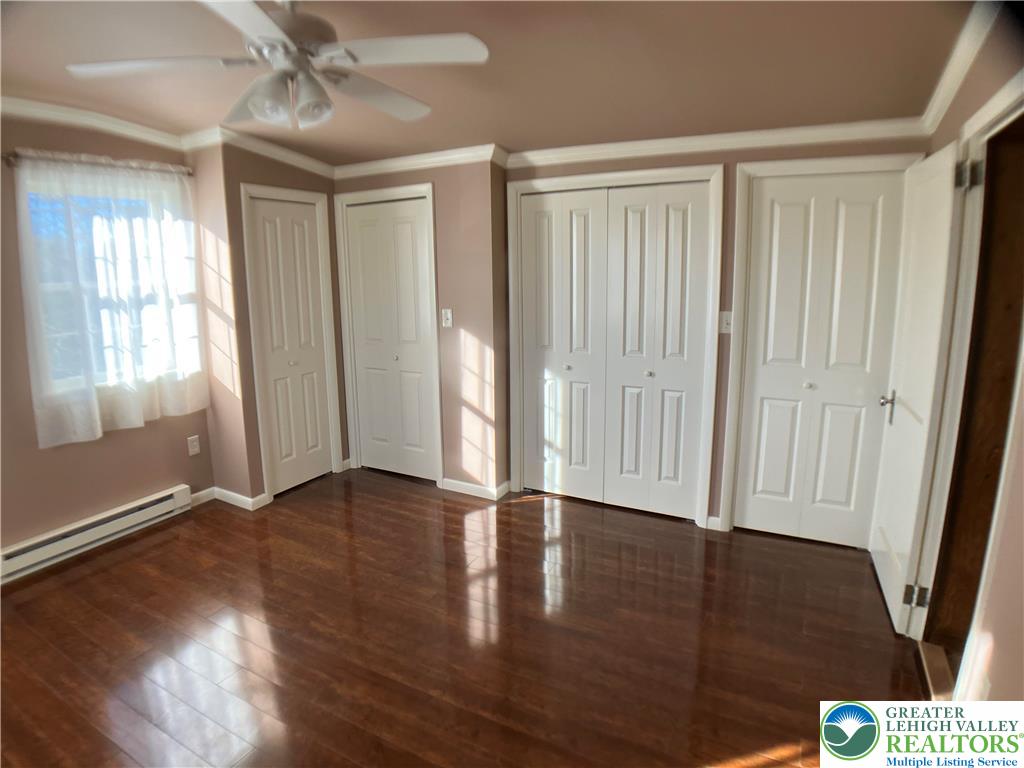 4131 Orefield Road Allentown, PA 18104 - Photo 18 of 20 an empty room with wooden floor and a window