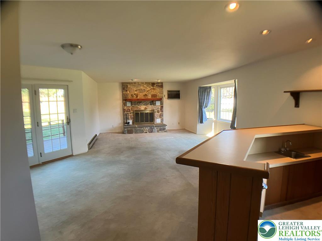 4131 Orefield Road Allentown, PA 18104 - Photo 19 of 20 a open kitchen with stainless steel appliances granite countertop a sink and a white cabinets