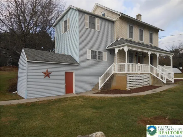 a front view of a house with garage