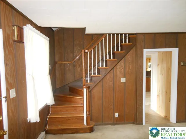 a view of an empty room and a window