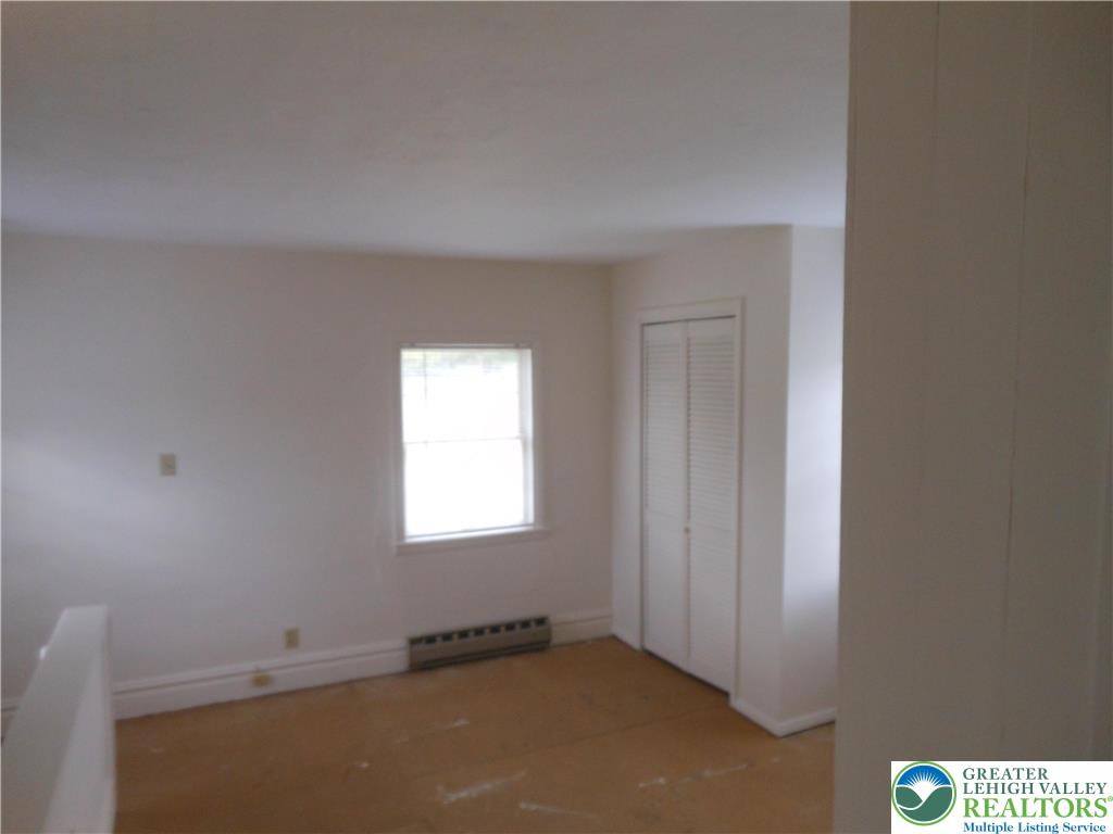 4131 Orefield Road Allentown, PA 18104 - Photo 9 of 20 a view of an empty room and a window