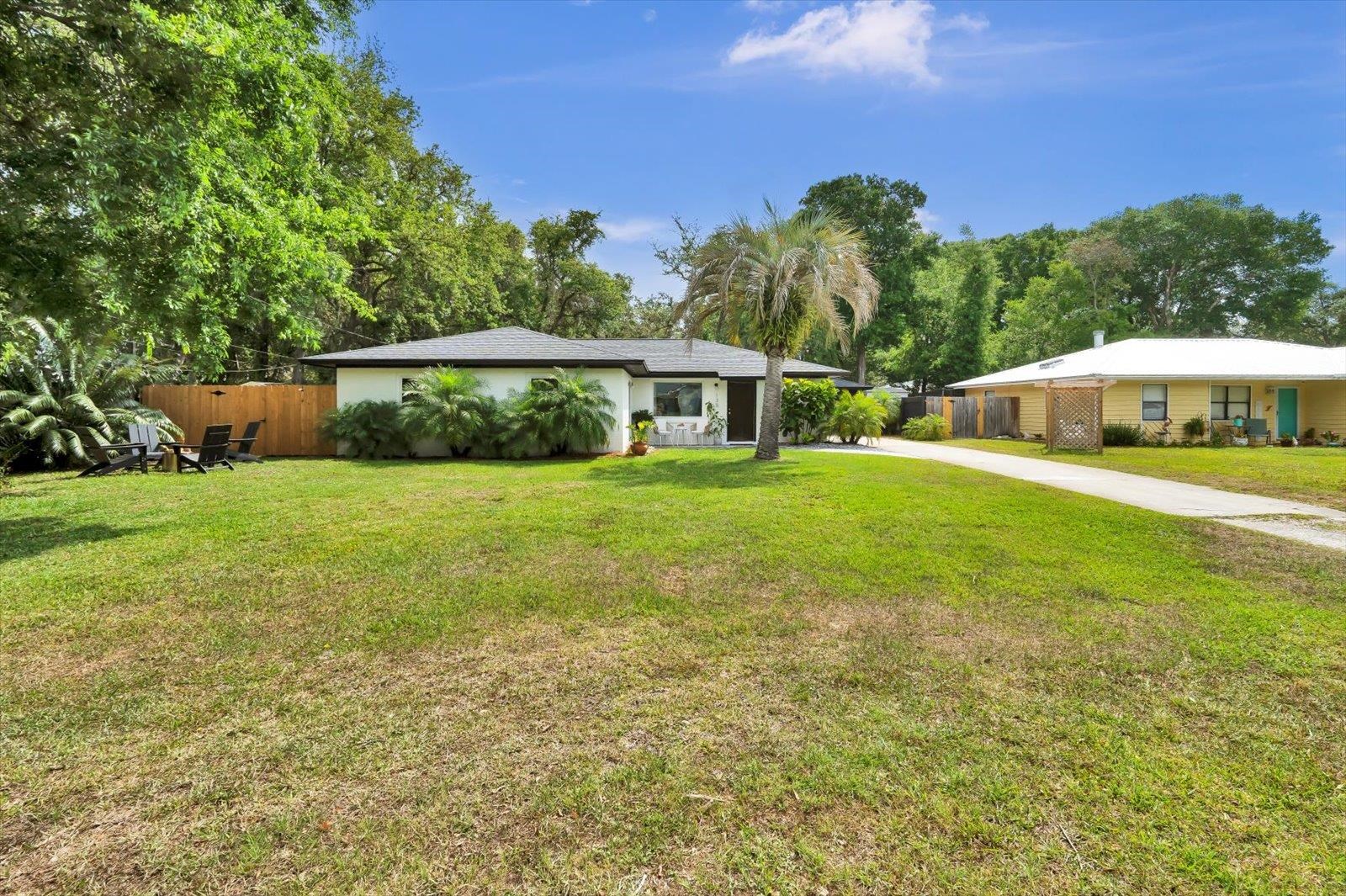 135 Orchis Road St. Augustine, FL 32086 - Photo 11 of 50 a view of an house with a garden and yard