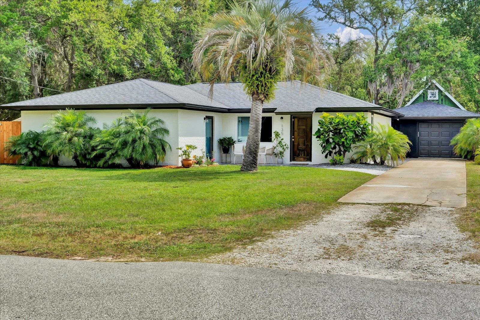 135 Orchis Road St. Augustine, FL 32086 - Photo 12 of 50 a view of a house with a yard and sitting area
