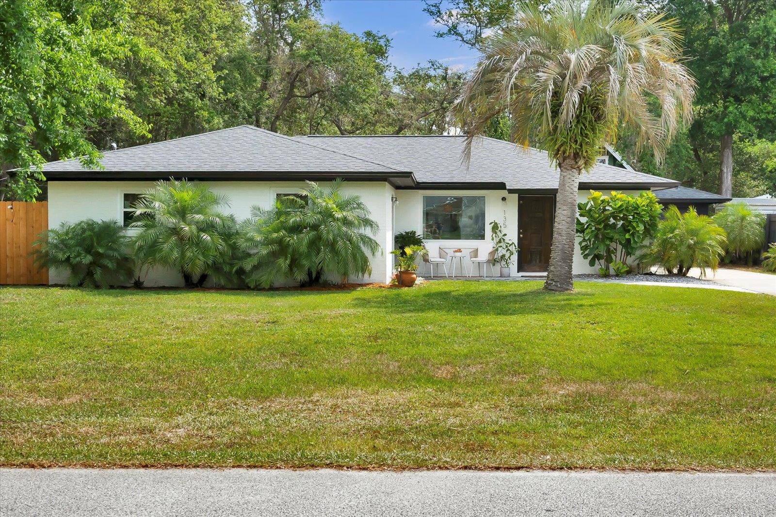 135 Orchis Road St. Augustine, FL 32086 - Photo 13 of 50 a front view of a house with garden