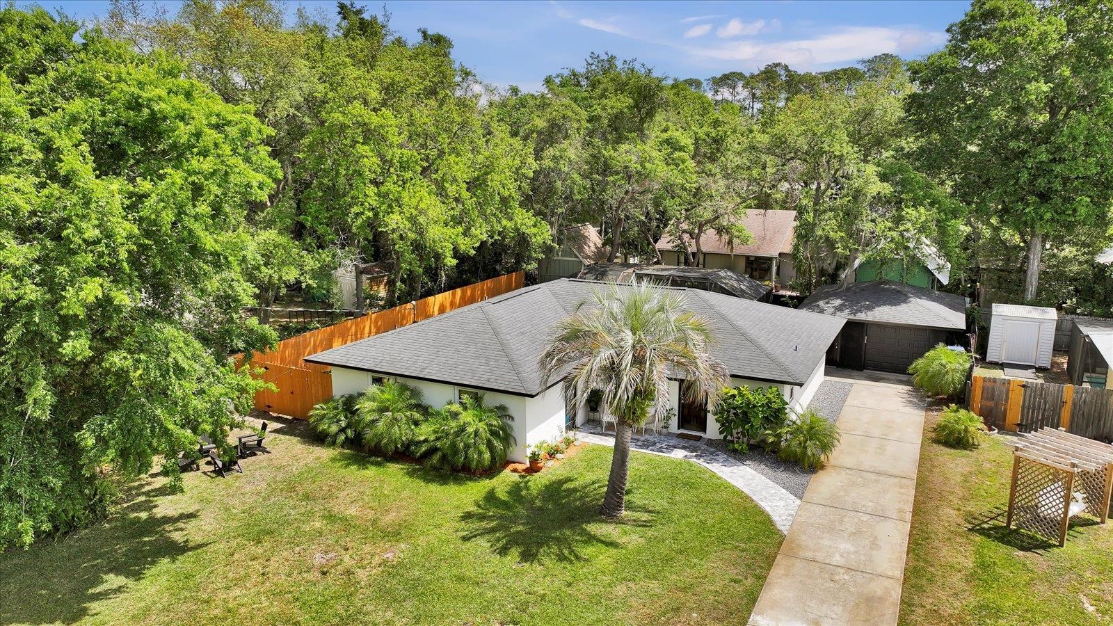 135 Orchis Road St. Augustine, FL 32086 - Photo 3 of 50 an aerial view of a house with yard swimming pool and outdoor seating