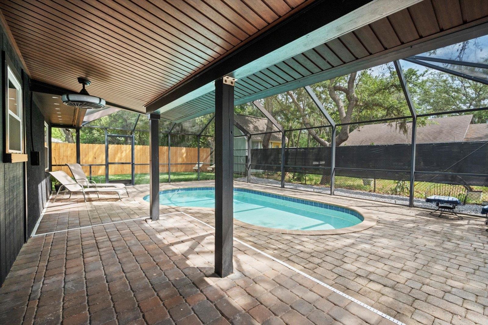 135 Orchis Road St. Augustine, FL 32086 - Photo 42 of 50 a view of a swimming pool with a porch