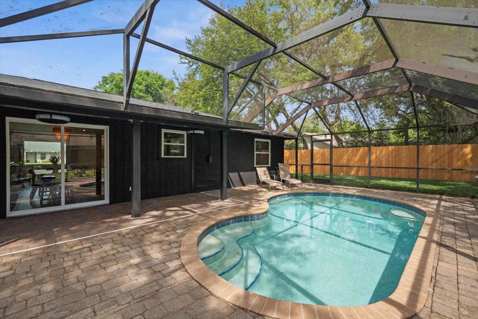 135 Orchis Road St. Augustine, FL 32086 - Photo 44 of 50 a view of a backyard with a small deck