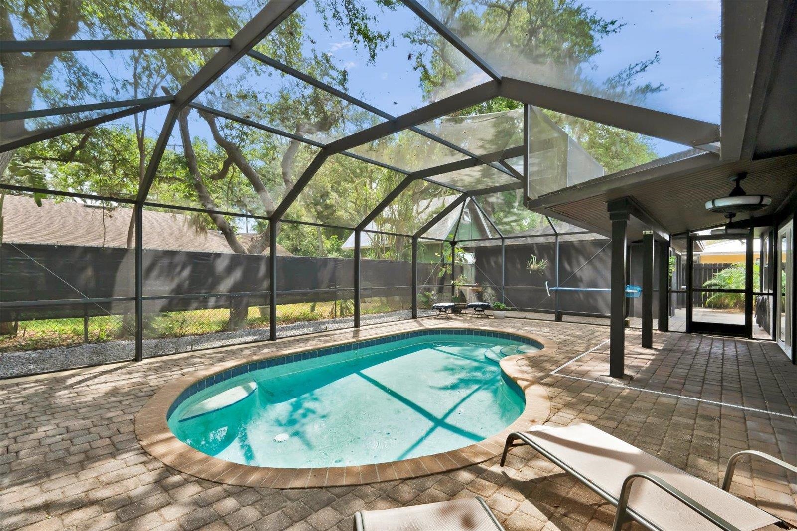 135 Orchis Road St. Augustine, FL 32086 - Photo 46 of 50 a view of a swimming pool with a patio
