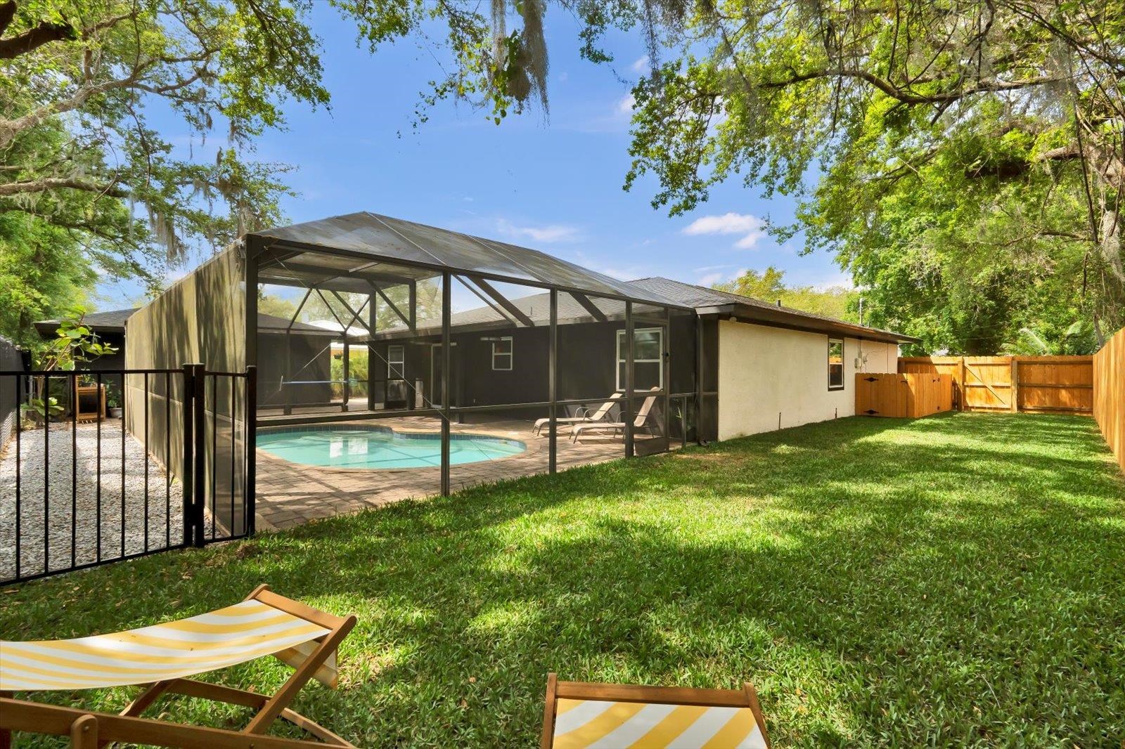135 Orchis Road St. Augustine, FL 32086 - Photo 48 of 50 a view of a house with backyard and sitting area
